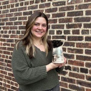 Kyra Pruitt with her raku finished pot