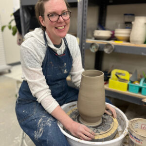 Kat Reeves - Ceramic artist and educator throwing vessel on the wheel